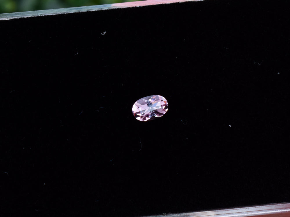0.54 carat Fluorescent Malaya Garnet