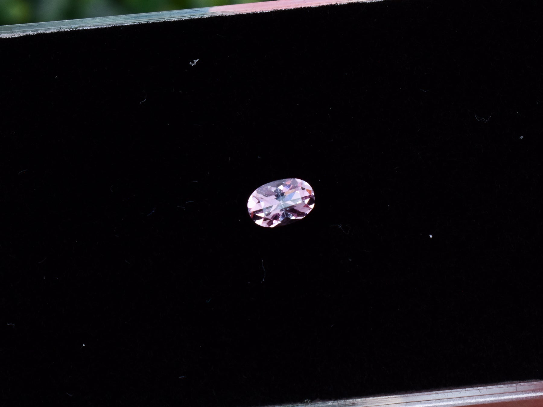 0.54 carat Fluorescent Malaya Garnet