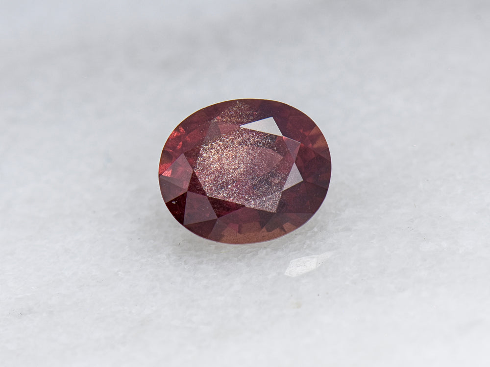 1.49 ct Reddish Orange Schiller Sapphire